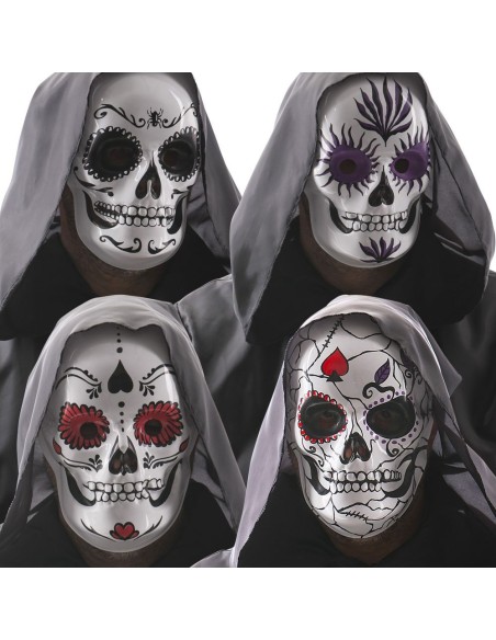 Quattro maschere teschio messicane colorate in plastica con decorazioni floreali per Halloween