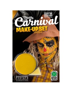 Vasetto fondotinta giallo cremoso per trucco teatrale e carnevale su sfondo con maschera spaventapasseri