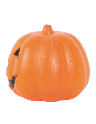 Due zucche luminose arancioni con volti intagliati su foglie autunnali per decorazioni Halloween