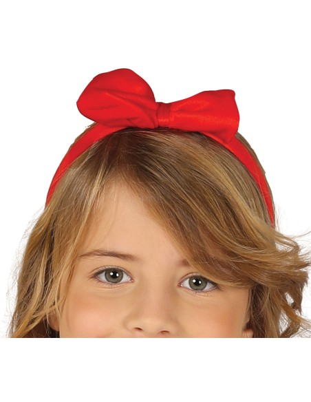 Bambina indossa costume Biancaneve con corpetto blu, gonna dorata e fiocco rosso per Carnevale